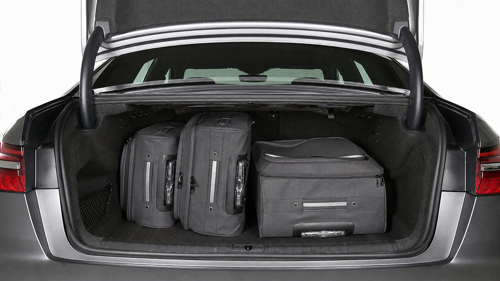Audi A6L luggage compartment with dark grey luggage