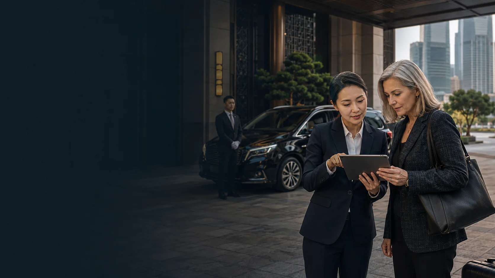 An international business traveller reviewing a multi-city chauffeur itinerary with a program manager in Shanghai